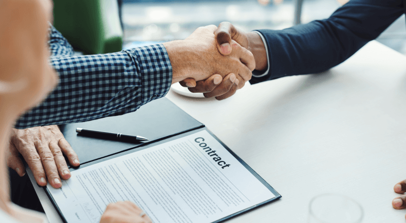 24f309e2 two men shaking hands 1.png